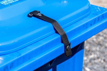 Wheelie bin lid lock strap with webbing bridge for strong winds